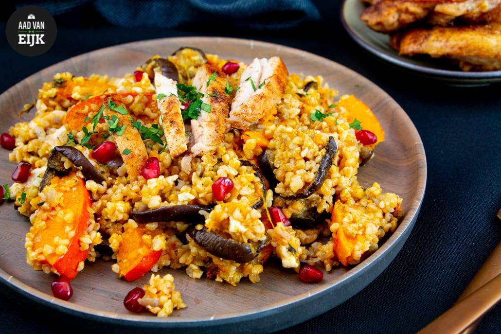 Cous cous met gekruide kippendij & pompoen